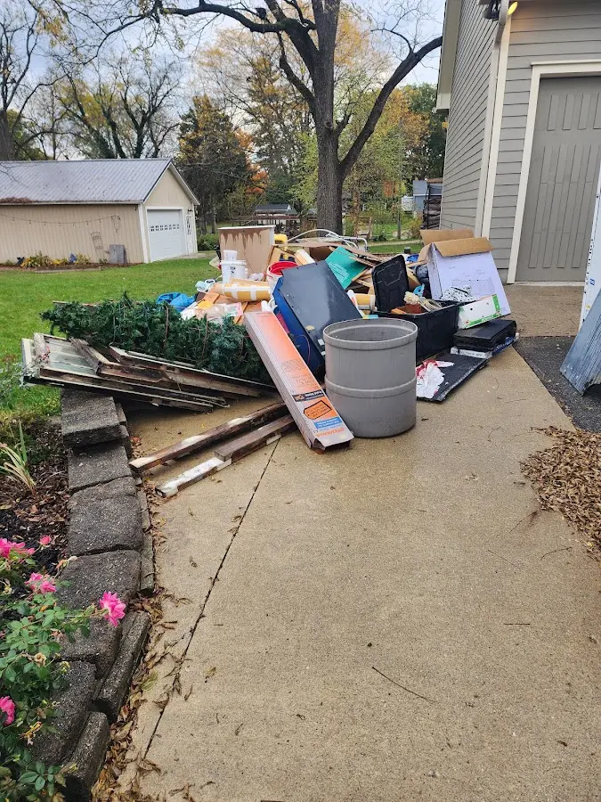 Dumpster being loaded with debris for Commercial Dumpster Rental in Hoover